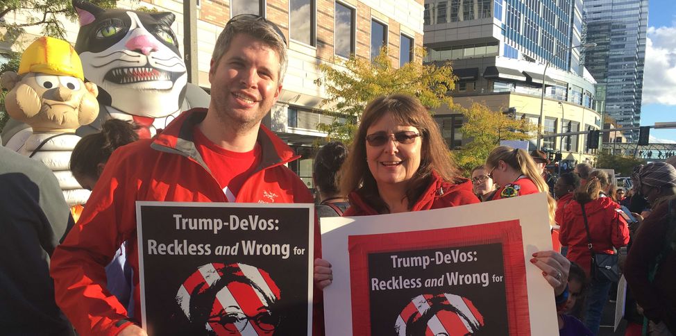 Educators with Reckless Wrong DeVos sign