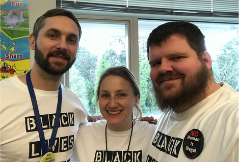 Luke Michener and Terry Jess posse with a colleague wearing Black Lives Matter shirts.